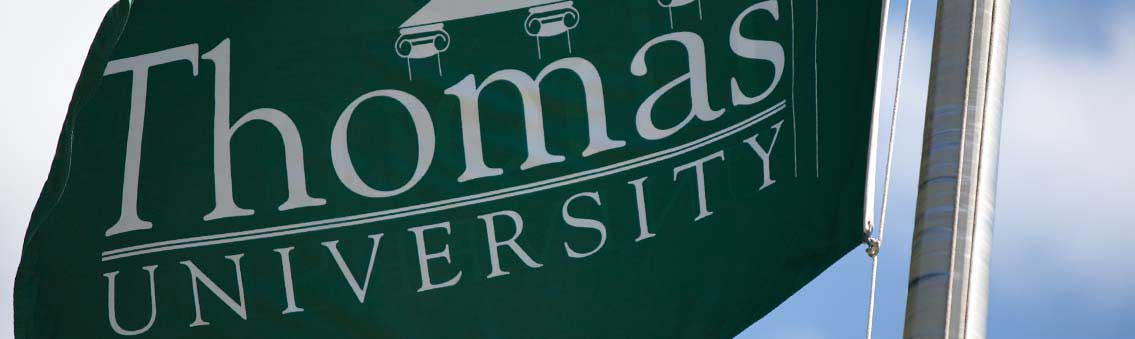 public relations Thomas University flag