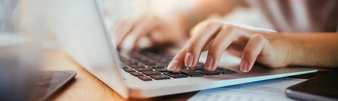 woman using a computer for online classes