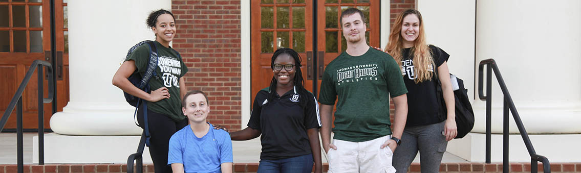 Thomas University students in front of Smith-Bonvillian Hall