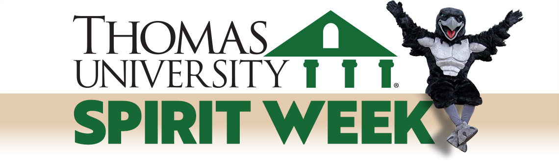 TU mascot Talon sitting on a sign that says Thomas University Spirit Week